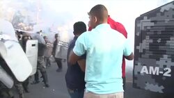 CLEAN : Honduras: Ex president Zelaya pushed by police in cloud of gas News Clip