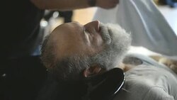 Barber hand wash head elderly clients Stock Footage