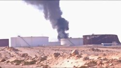 One of Libya's biggest oil facilities was hit on Thursday by a Grad rocket, setting an oil storage tank on fire. (Dec. 25) News Clip