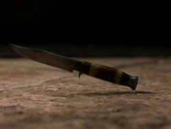 High speed Knife falling on pavement, low angle Stock Footage