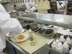POV food being prepared at the hot plating area in a restaurant kitchen Stock Footage