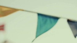 Holiday, festive flags on the beach Stock Footage