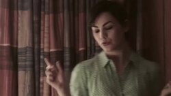 Young woman paces back and forth frantically in motel room Stock Footage