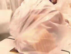 Butcher Bagging Meat in Smithfield Market News Clip