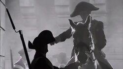A silhouetted soldier in a French Revolution uniform takes orders from a military leader on horseback. Stock Footage