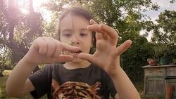 LEARNING PROCESS. Gender Neutral Child Playing With Insects. Stock Footage