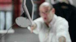 SLO MO Man throws his computer through the window Stock Footage