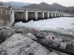 Dolly shot Watergate is draining a stream of water Stock Footage