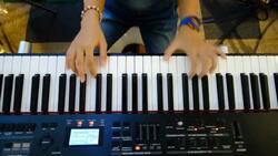 Girl playing on a synthesizer Stock Footage