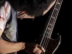 CU TD Shot of young man playing bass guitar / Shinjuku, Tokyo, Japan Stock Footage