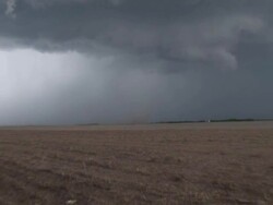 Weak Tornado or gustnado dust swirl, under huge cloud, WA, USA Stock Footage