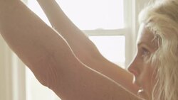 A mature woman works out in her home gym in slow motion. Stock Footage