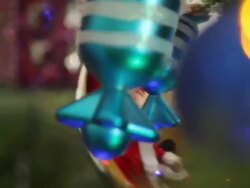 boy decorates the Christmas tree toys Stock Footage