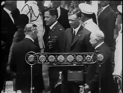B/W 1927 Charles Lindbergh shaking hands with Calvin Coolidge by microphones after historic flight Stock Footage