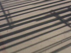 MS TU Metal frame net panel shadow with large building / Lagos, Nigeria Stock Footage