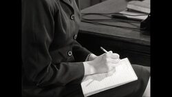 CU Young deaf woman writing on notepad / United States Stock Footage