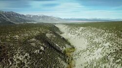 Aerial view of the Owens River Gorge with the Sherwin Mountain Range in the background. Stock Footage
