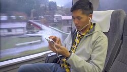 A Man using smartphone in train Stock Footage