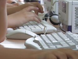 Boys Typing at Keyboards Stock Footage