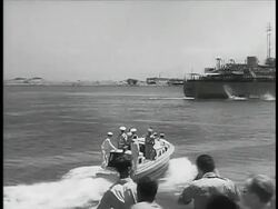 B/W 1948 motorboat with British command moving towards ship / documentary Stock Footage