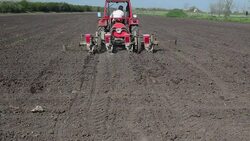 Tractor sowing cereals. Agricultural machinery for planting cereals. Stock Footage