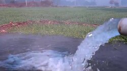 watering in the field during winter season Stock Footage