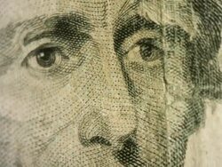 Andrew Jackson's face moves shakily into and out of focus on the US $20 bill Stock Footage