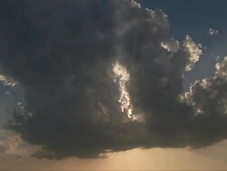 MS Shot of sunrays shine through towering cumulus cloud / Oklahoma, United States Stock Footage