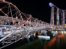 View along Helix Bridge to Marina Bay Sands Singapore. Marina Bay, Singapore Stock Footage