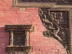 WS Wood carvings on side of  brick building  / Kathmandu, Central, Nepal Stock Footage