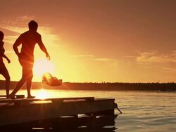 Young adult couple jumps into lake. Stock Footage