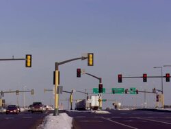 MS View of traffic light changing from yellow to green with airplane taking off / Minneapolis, Minnesota, United States Stock Footage