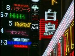 MCU Multi-coloured neon signs, flashing at night, Japanese and English wording, Tokyo Stock Footage