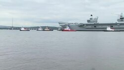 HMS Queen Elizabeth, the Royal Navy's new aircraft carrier, leaves dock to begin sea trials News Clip