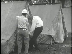 Inventors Thomas Edison, Henry Ford, tire manufacturer, Harvey Firestone and U. S. President Warren G. Harding enjoy a camping trip. News Clip
