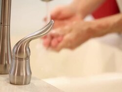 Man washing his hands at home kitchen sink. Stock Footage