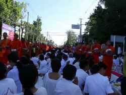 Monks walk to collect alms and offerings food and drink in vesak day on Chiang Mai, Thailand. Stock Footage