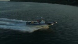 A family cruises across Narragansett Bay in a powerboat. Stock Footage