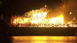 A sculpture marking the Great Fire of London set alight on the Thames News Clip