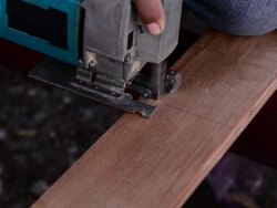 Panning Cutting wooden floor by electric saw Stock Footage