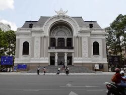 WS View of traffic moving on street in front of Royal Opera House / Ho Chi Minh, Vietnam Stock Footage