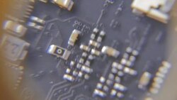 Close-up of Circuit Board under the Magnifying Glass Stock Footage