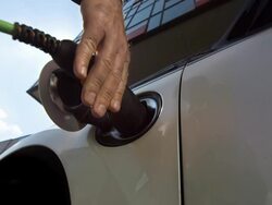 HD SLOW MOTION: Hand Plugging An Electric Car Stock Footage