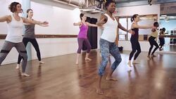 women working out in exercise studio Stock Footage