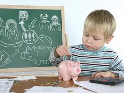 little boy and a piggy bank Stock Footage
