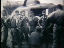 1961 B/W MONTAGE US soldiers standing around helicopter and conferring / South Vietnam Stock Footage