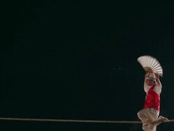 MS Shot of tightrope walker doing acrobatics on high wire at night / Gyeonggido, South Korea Stock Footage