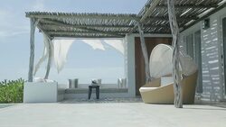 Wind blowing sheets on luxury patio Stock Footage