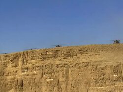 Aerial Military Helicopters on cliff in Desert, Arava, Israel Stock Footage