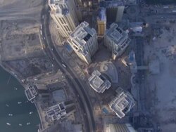 WS AERIAL View of city with skyscrapers, swimming pools and building site / Dubai, United Arab Emirates Stock Footage